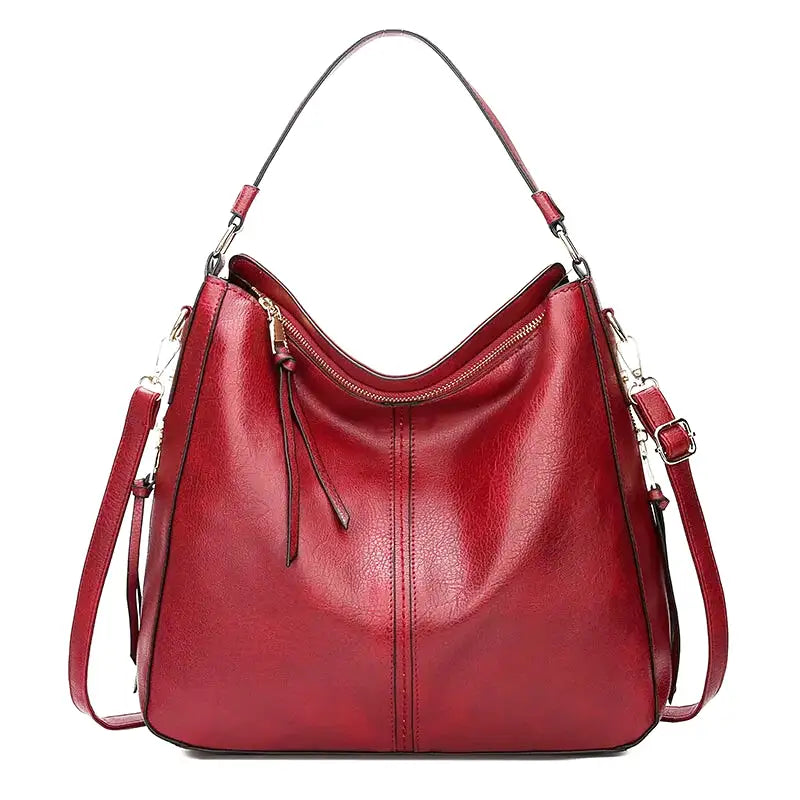 Sac à main AURA en cuir synthétique, large et spacieux, avec bandoulière réglable, alliant élégance et praticité pour femmes modernes