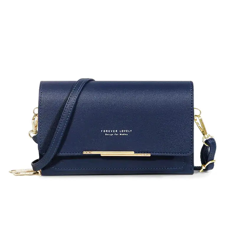 Sac à main CASSIE en cuir synthétique bleu marine, bandoulière ajustable, avec rabat, compartiments et poches pour organiser vos essentiels avec style et praticité.