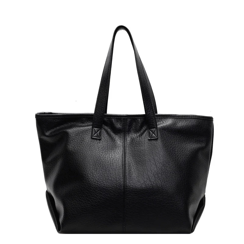 Sac à main KIM en cuir synthétique noir, moderne et pratique, grand sac tote bag avec intérieur spacieux et finitions soignées, parfait pour le quotidien et le travail.