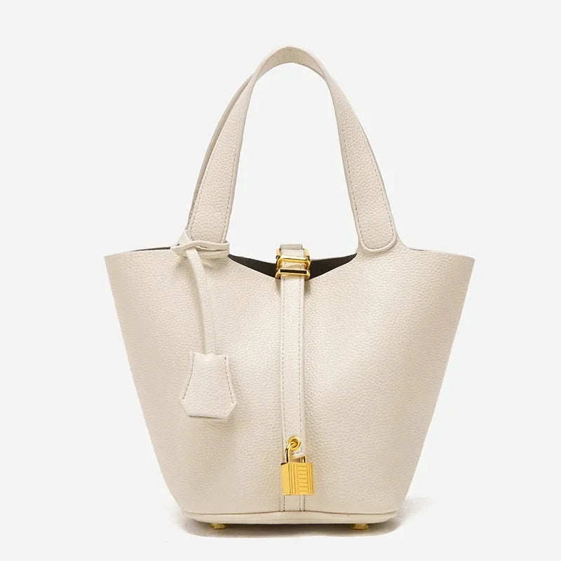 many sac seau en cuir beige finition doré