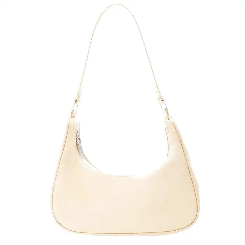 Petit sac à main MELIA en cuir vegan souple jaune, format compact avec design chic et minimaliste, idéal pour une sortie élégante.
