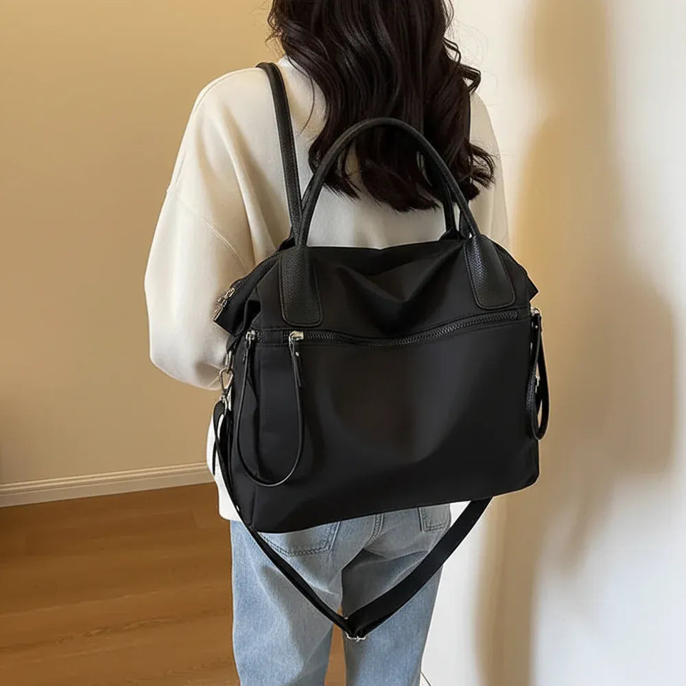 Naya - Sac Bandoulière Grande Capacité noir Femme pour Ordinateur 15 Pouces, Cahiers, Documents A4 et Essentiels