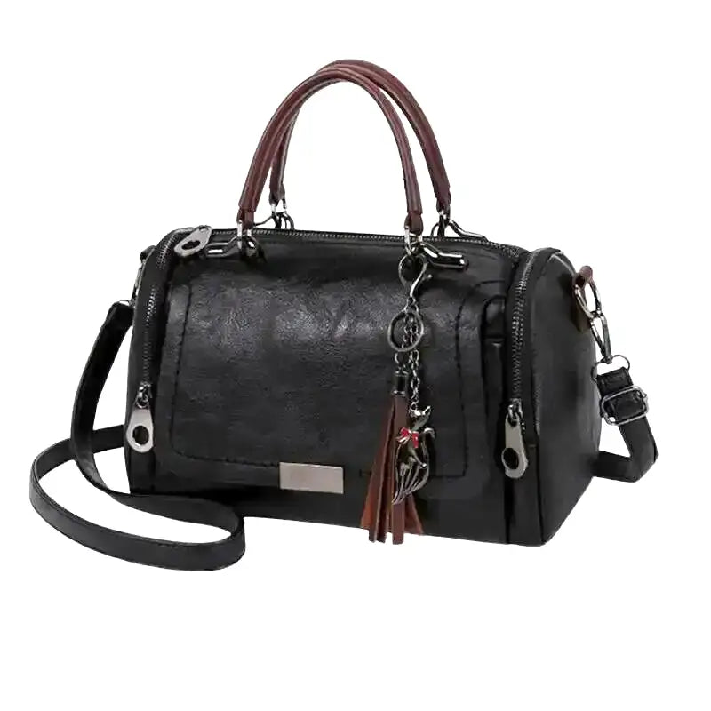 Sac à main RAYA en cuir souple noir spacieux avec sangle ajustable et fermeture éclair élégante.