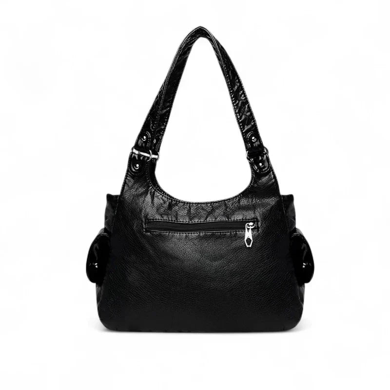 Grand sac à main femme VICTOIRE en cuir noir vegan élégant et structuré, spacieux et organisé, parfait pour transporter ordinateur, cahiers et essentiels avec style et praticité.