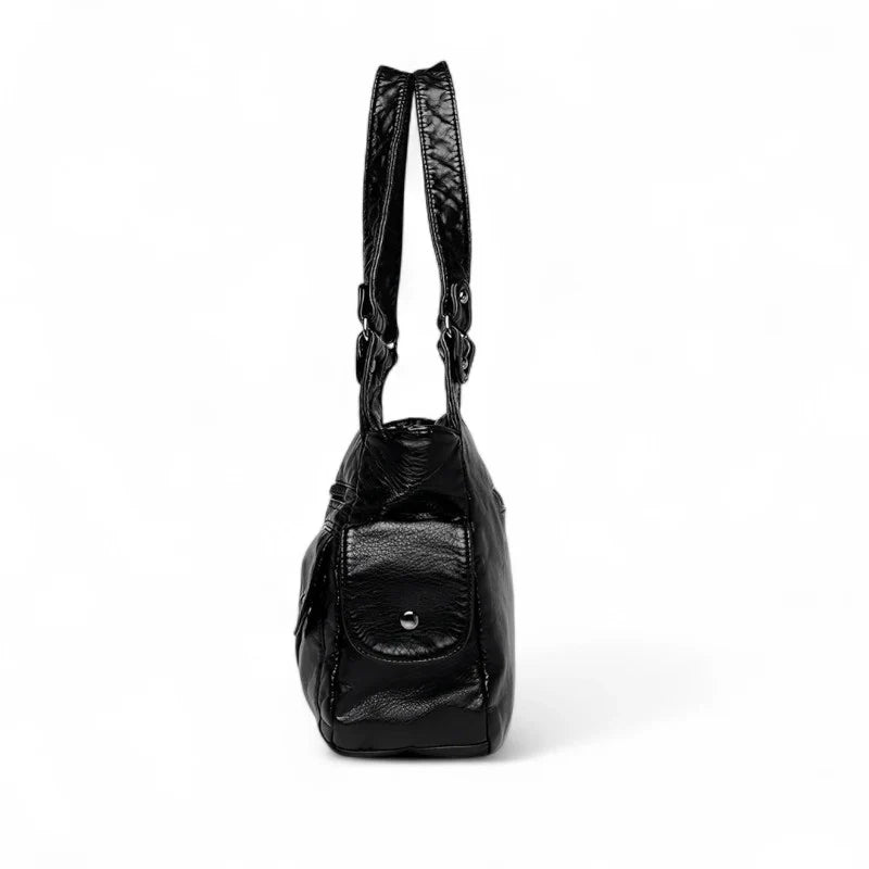 Grand sac à main femme VICTOIRE en cuir noir vegan élégant et structuré, spacieux et organisé, parfait pour transporter ordinateur, cahiers et essentiels avec style et praticité.