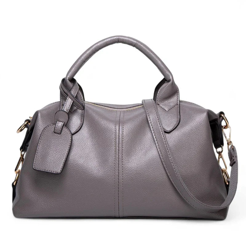 Sac à main bandoulière Yaelle en cuir gris texturé, élégant et pratique pour étudiantes et jeunes femmes, avec bandoulière ajustable, design chic et compartiments organisés pour transporter cahiers, ordinateur et accessoires du quotidien.