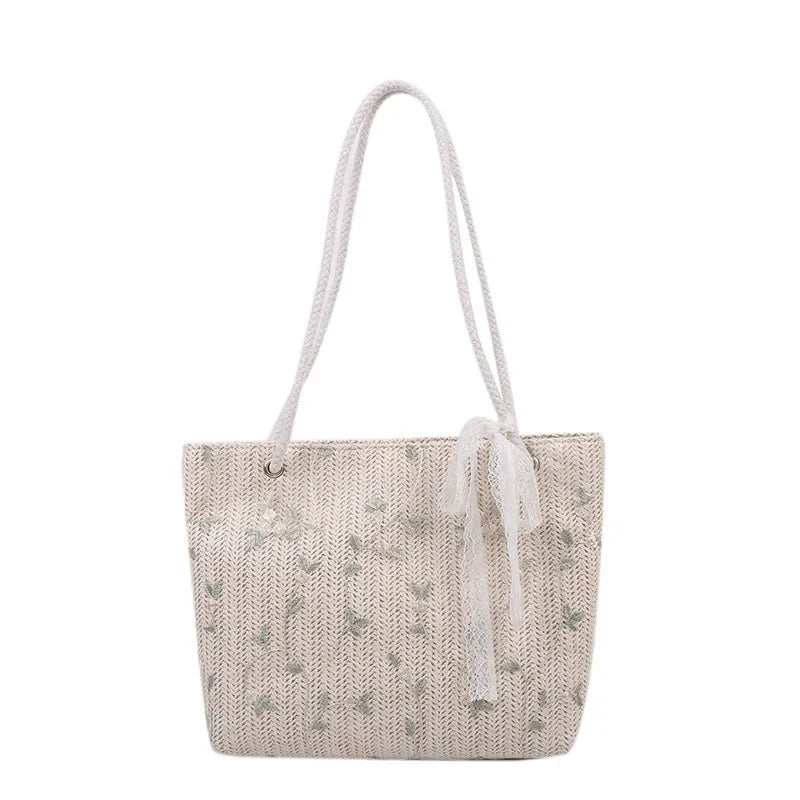 Sac ARWA cabas rose tissé en matières naturelles, grand et léger, design bohème chic, idéal pour transporter vos essentiels avec style au quotidien.