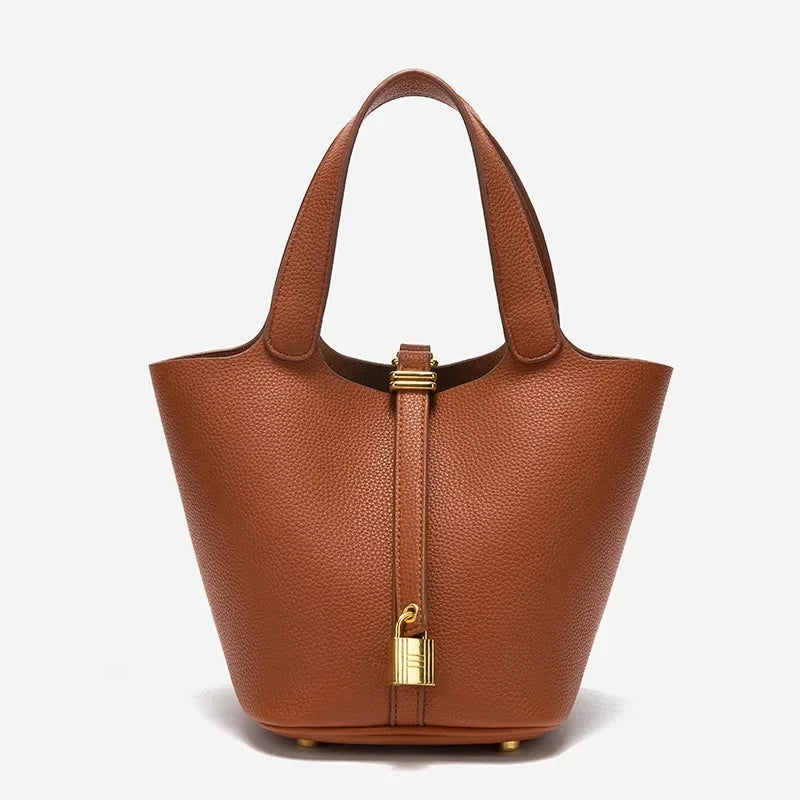 many sac seau en cuir marron finition doré