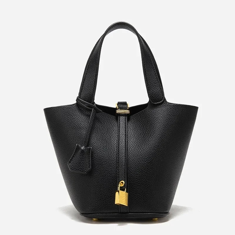 many sac seau en cuir noir finition doré